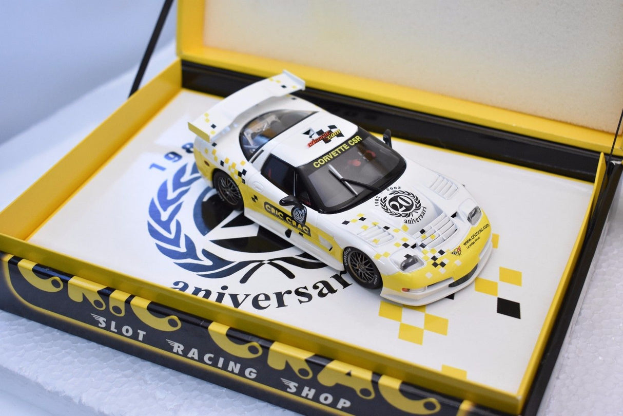 Yellow Corvette C5R slot car on a branded display box for Fly Car E123