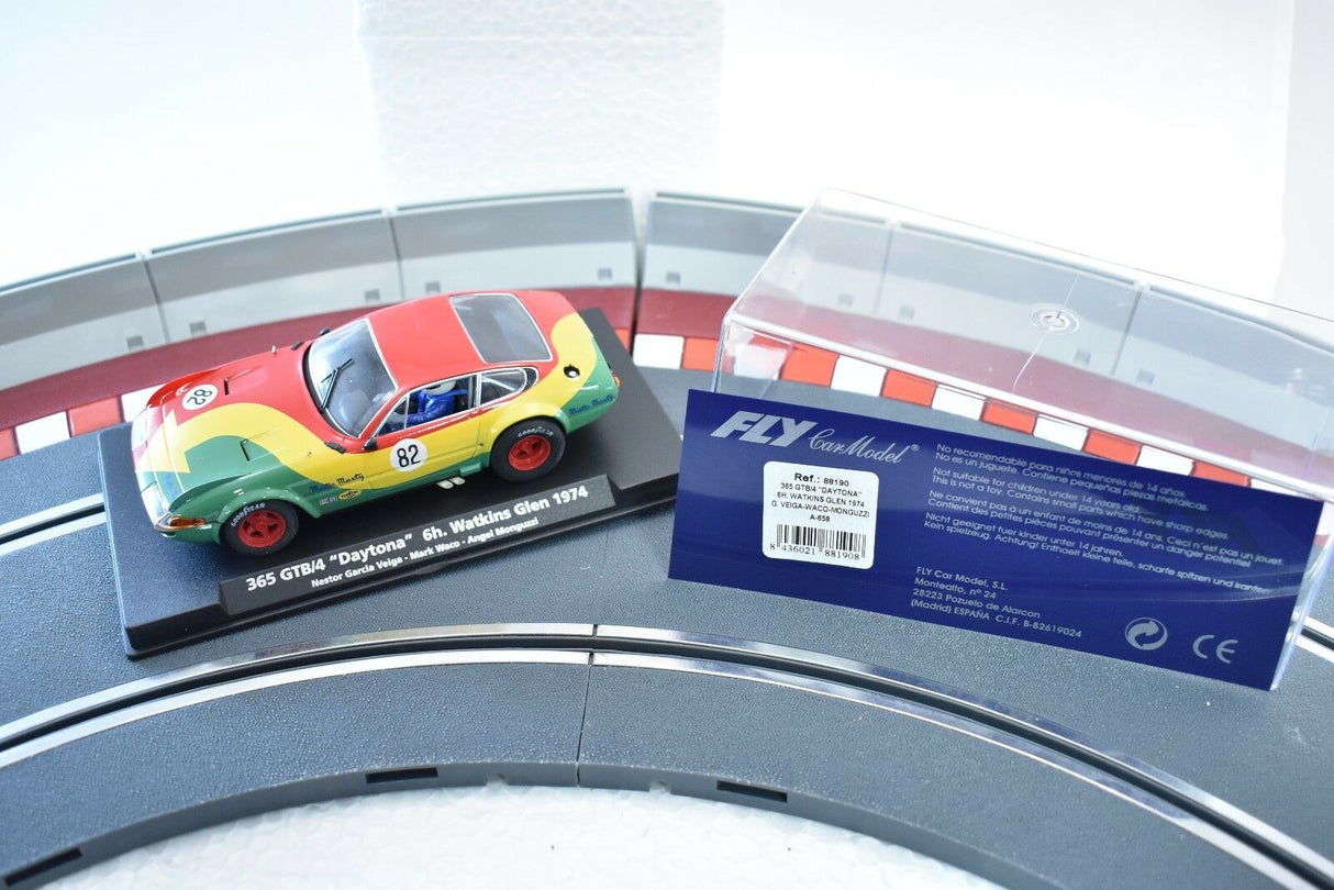 Red and yellow race car model, 1974 Daytona, displayed with packaging for Fly Car 88190
