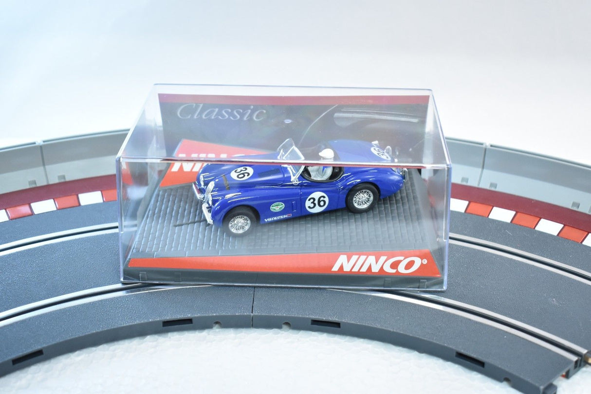 Blue classic race car in clear display case on track for ZZ Expired Kim Collection 50520