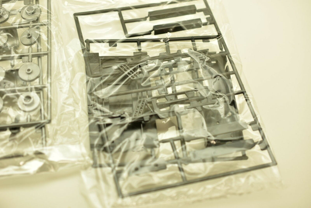 Plastic parts kit laid out in clear packaging for a model build for IMEX imx1214