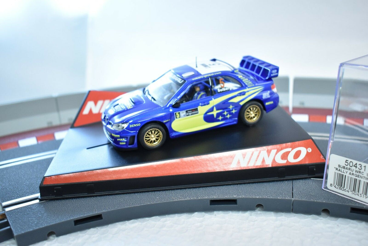 Blue Subaru WRC slot car on a track base for ZZ Expired Kim Collection 50431