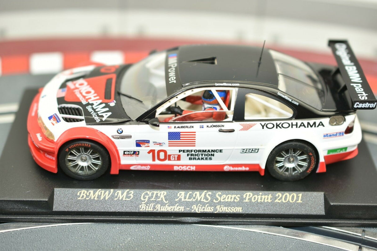 Slot car of a 2001 BMW M3 GTR race car on a display base for Fly Car 99001, side view