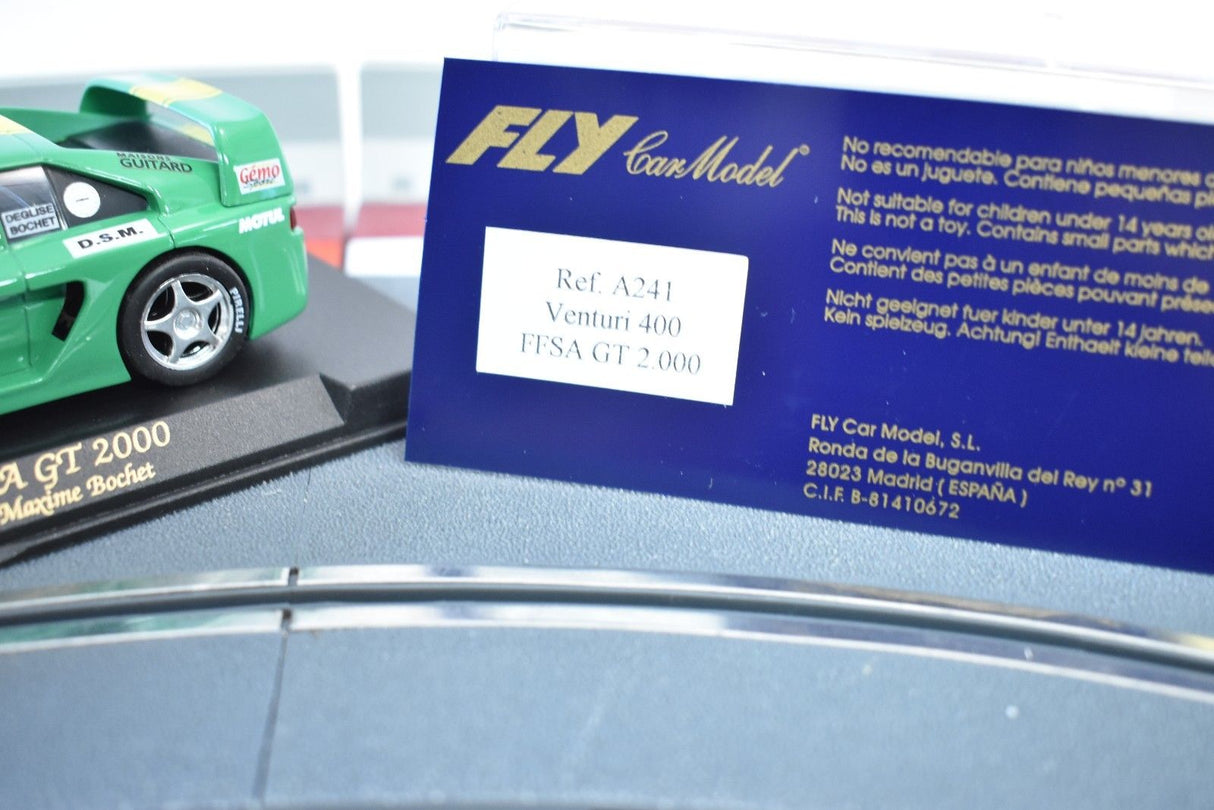 Green model car next to a sign for Venturi 400 FFSA GT 2000 for REH Fly A241