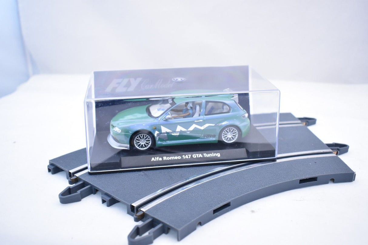 Green slot car of an Alfa Romeo 147 GTA Tuning car for Fly Car 07049