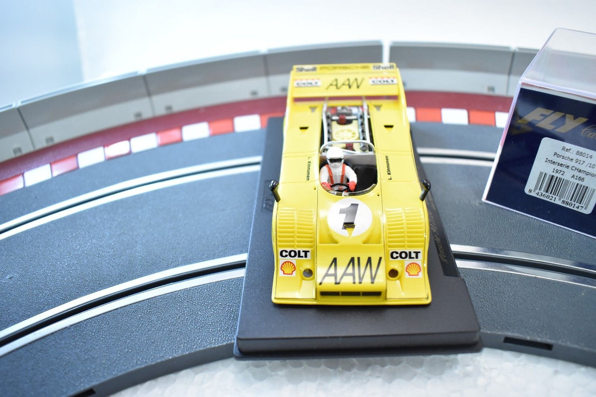Yellow race car model on track with "AAW" visible for Fly Car 88014
