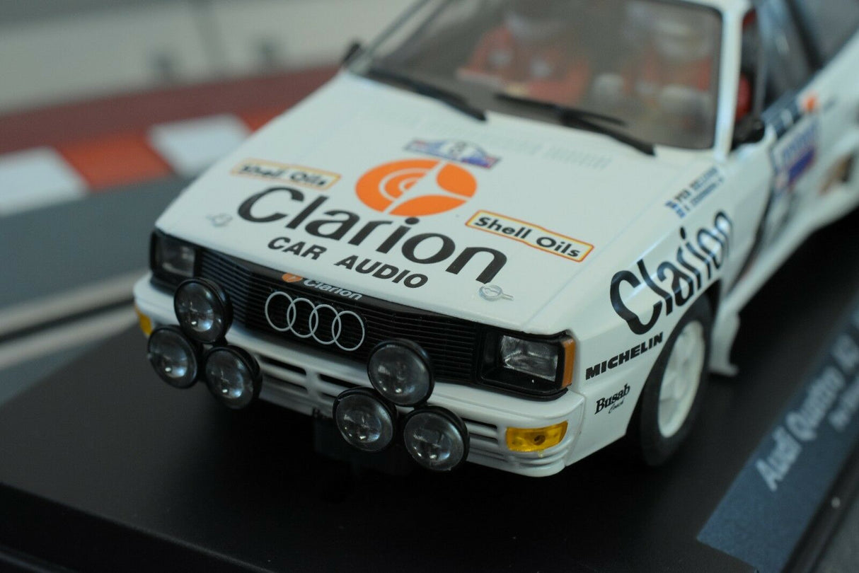 White model car, Audi Quattro, with sponsor decals, on a display base for Fly Car 88285
