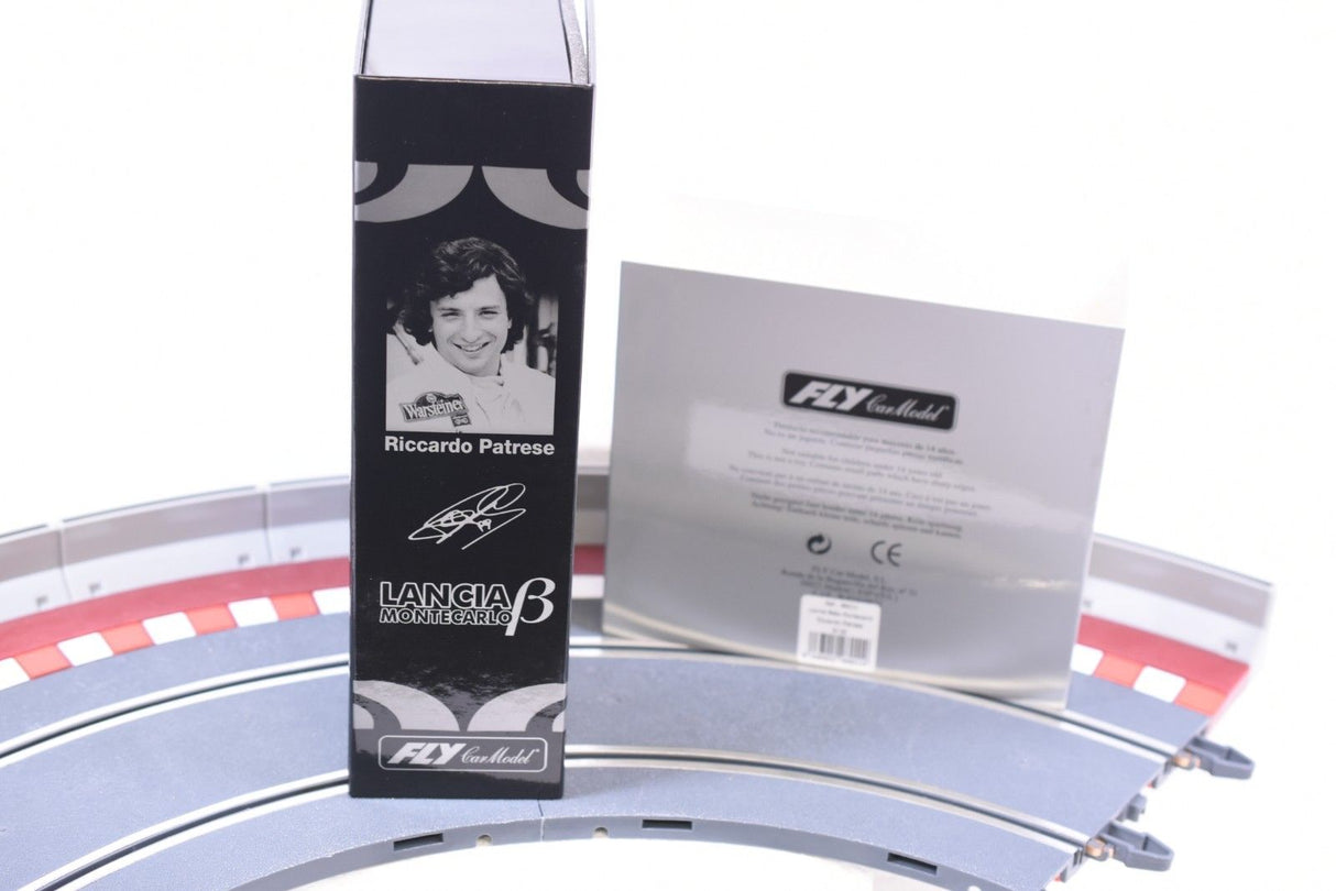 Lancia Montecarlo model kit box and card on a track section for Fly Car 96011