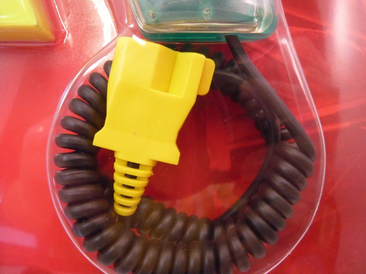 Yellow throttle with coiled black cable on red surface for SCX PRO 50180