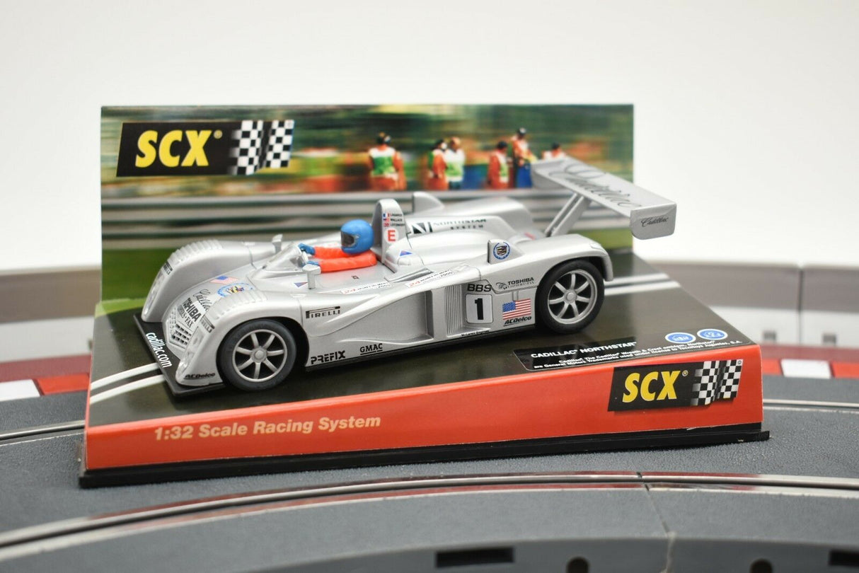 White race car model on display stand with "SCX" logo for 60470