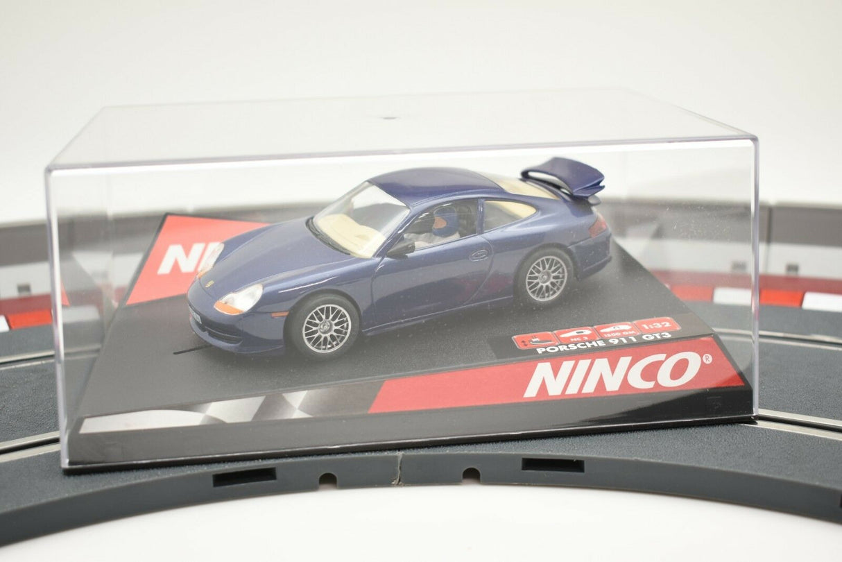 Blue Porsche 911 GT3 race car on a track base for NINCO 50234