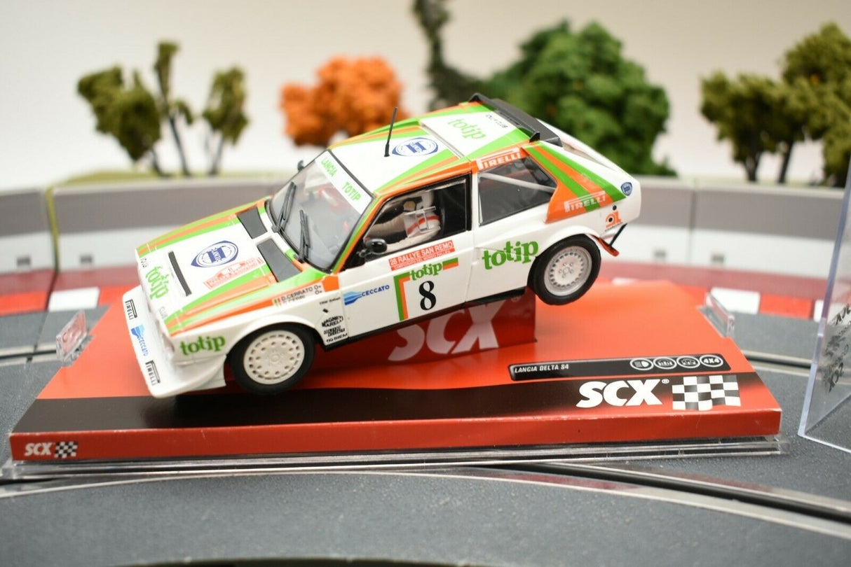 White rally car model, "Totip," on a red display base for SCX A10153X3U0