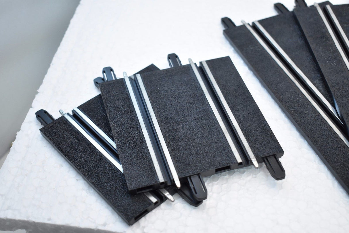 Assortment of scale track pieces in black and silver for SCX Compact 303057980155