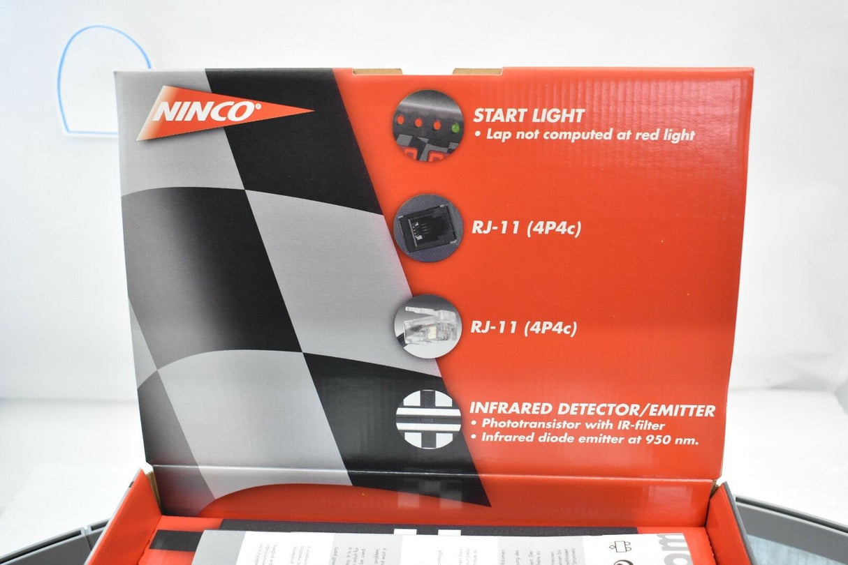 Electronic lap counter components in an open box for Ninco 10404