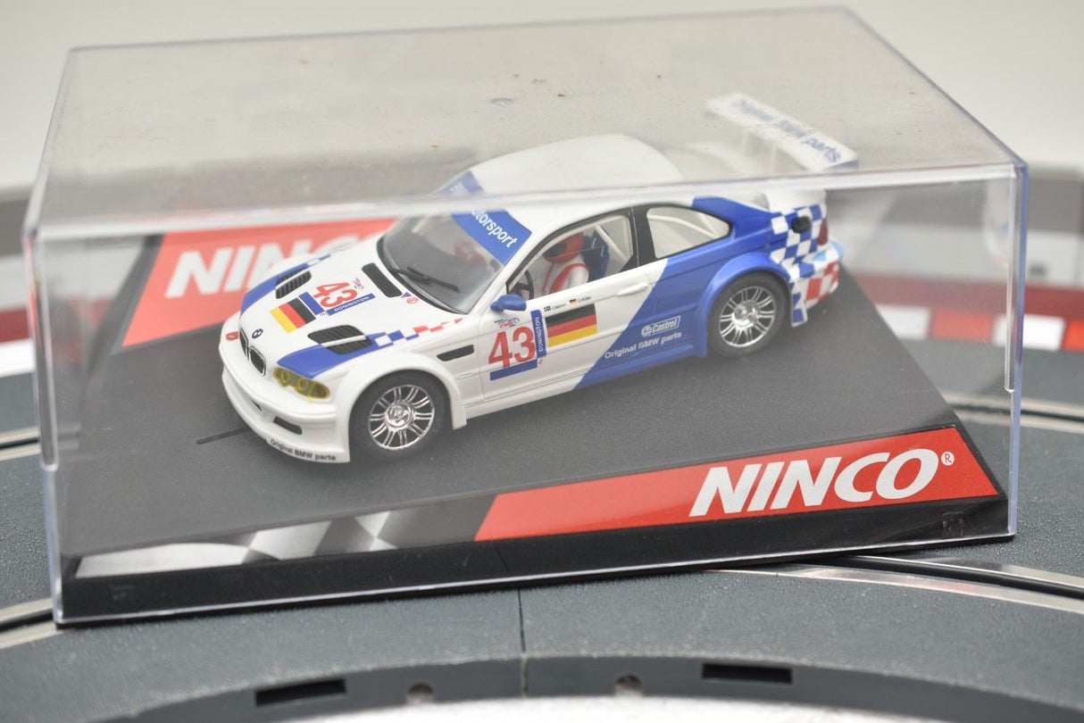 Blue and white BMW M3 GTR slot car in clear display case for REH Ninco 50271