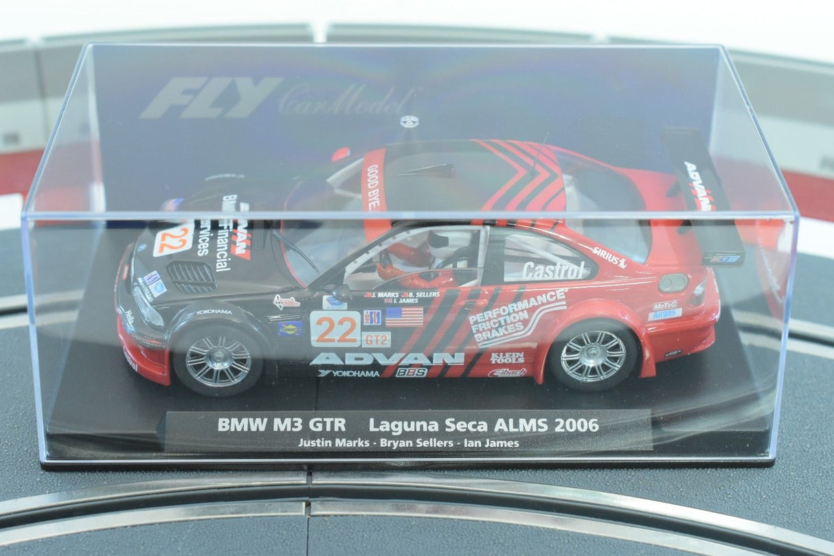 Red BMW M3 GTR race car model on a display base for Fly Car 88266, side view