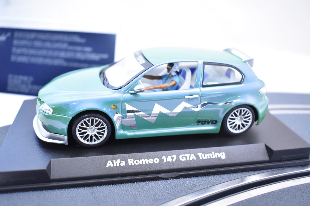 Green slot car of an Alfa Romeo 147 GTA Tuning for Fly Car 07049