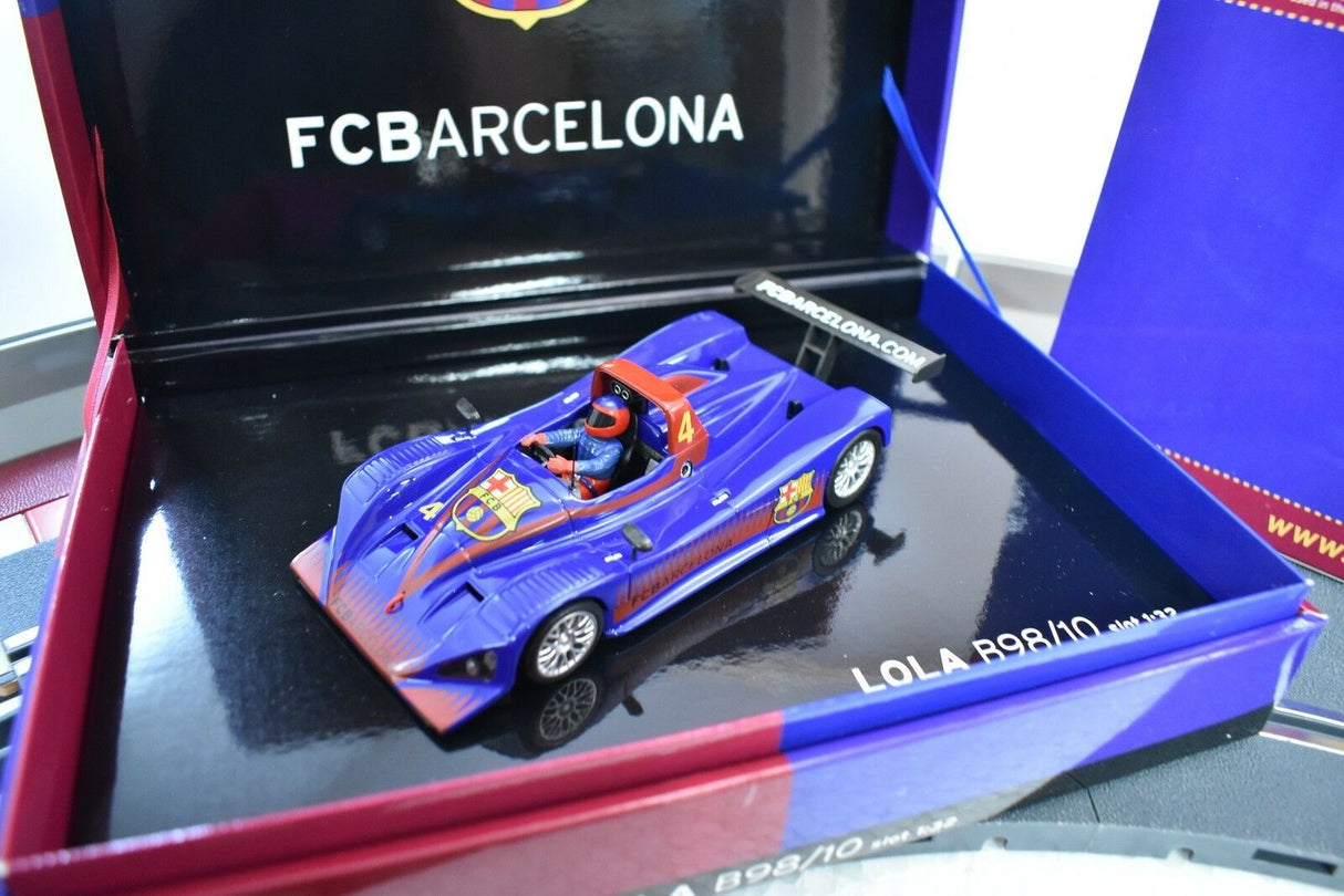 Blue and red race car model, Lola B98/10, displayed in a box for Fly Car 96013