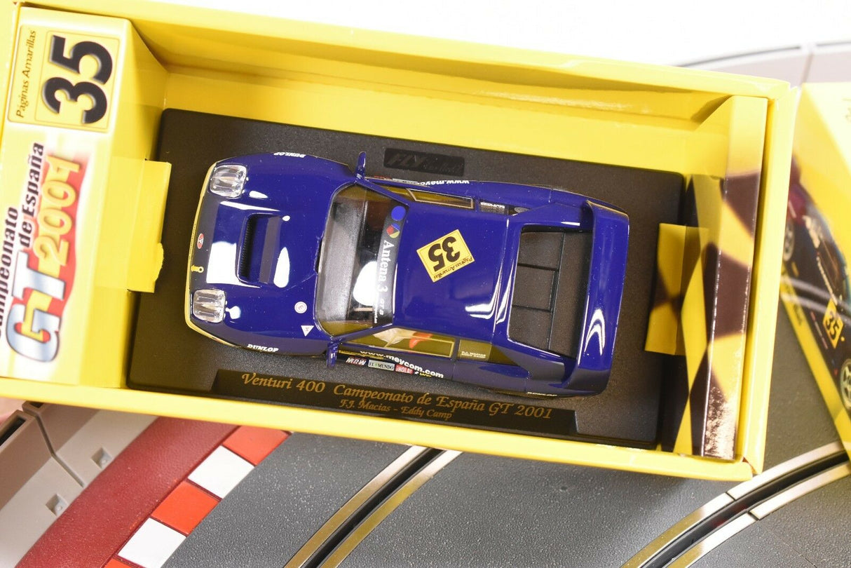 Blue and white race car model in its yellow display box for FLY CAR PA 6