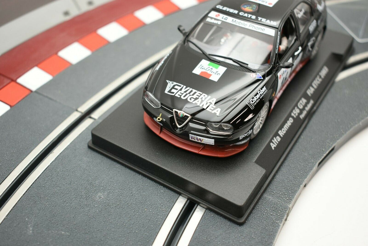 Black slot car on a track base, featuring "CLEVER CATS TEAM" livery for Fly Car 99015