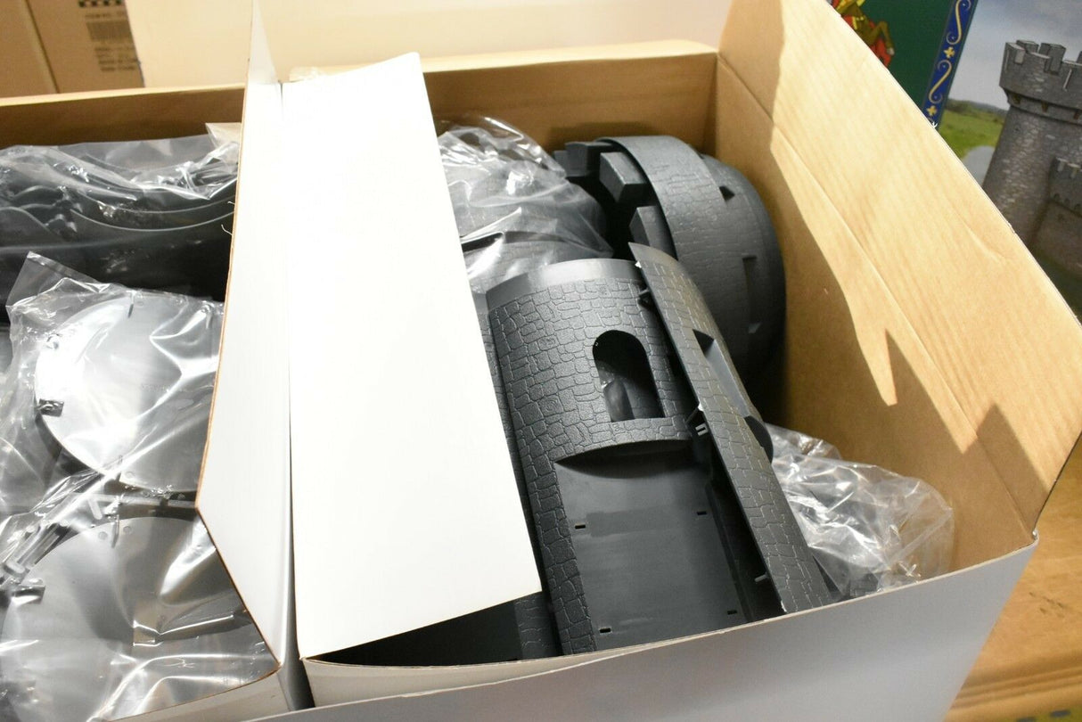Castle playset parts in an open cardboard box for IMEX IMX3282