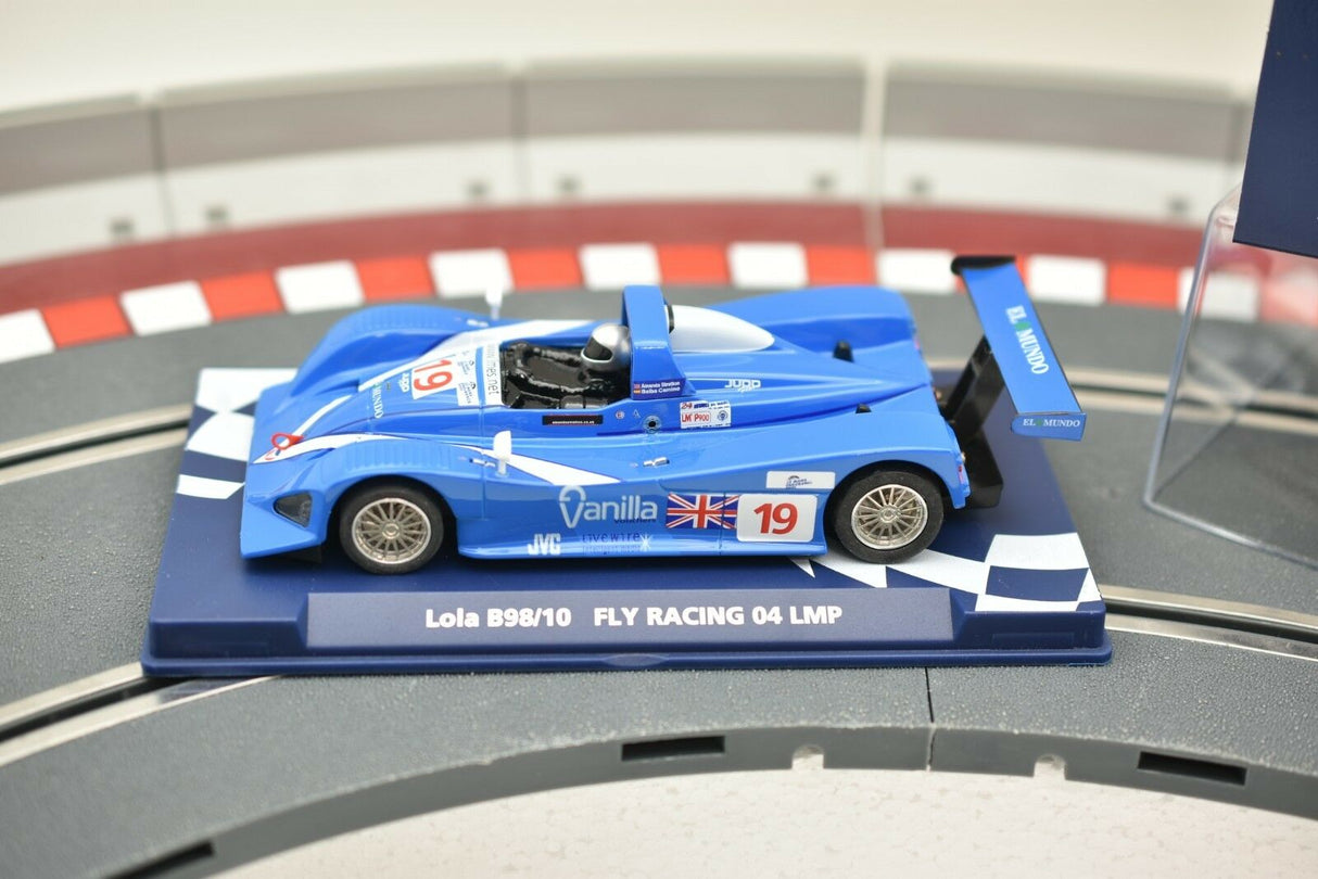 Blue race car model, Lola B98/10, on a display base for Fly Car 07051
