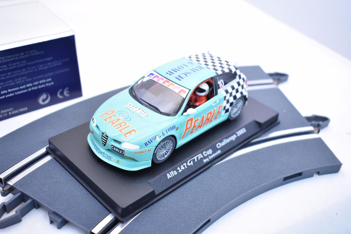 Slot car of a teal Alfa 147 GTA Cup race car on a display base for Fly Car 88112, front view