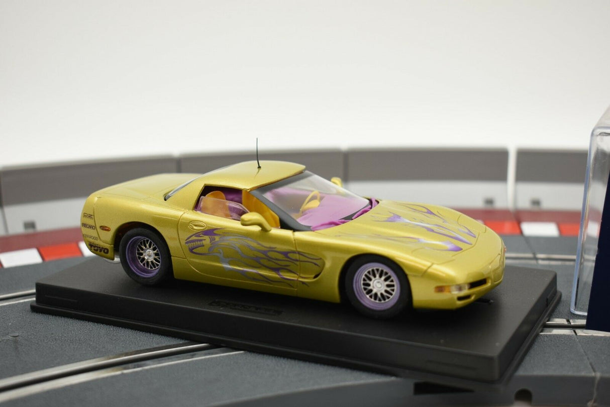 Yellow Corvette C5 model car with purple accents on a display base for Fly Car 07052