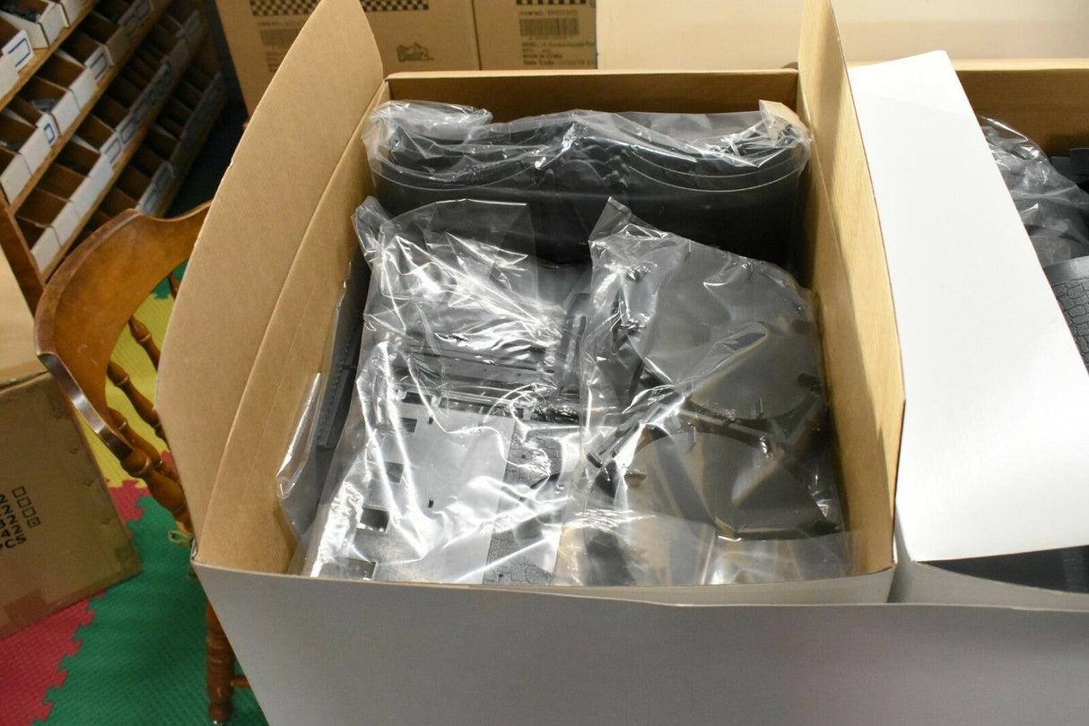 Assorted metal and plastic components packaged in a cardboard box for IMEX IMX3282
