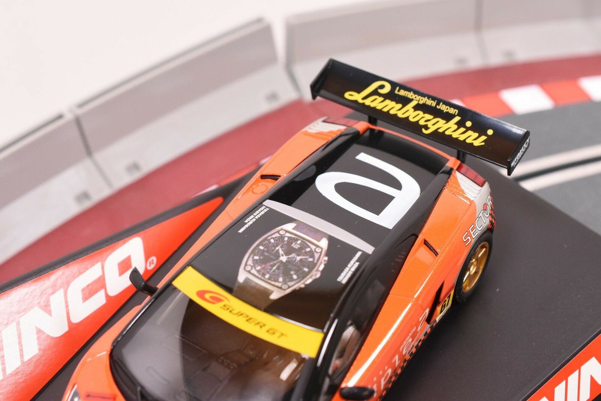 Orange Lamborghini slot car on a track section for ZZ Expired Kim Collection 50513