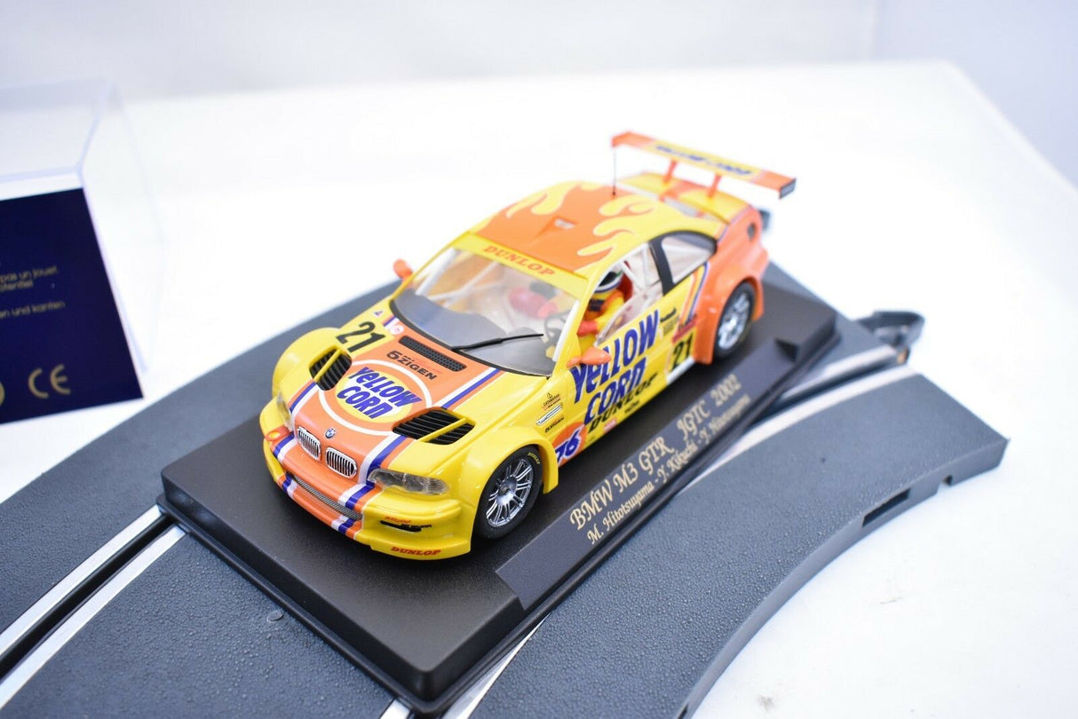 Yellow and orange slot car of a 2002 BMW M3 GTR race car for Fly Car 88017