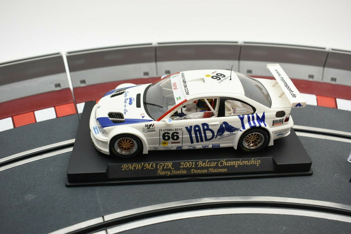 Slot car of a 2001 BMW M3 GTR race car on a display base for Fly Car 88013, front view