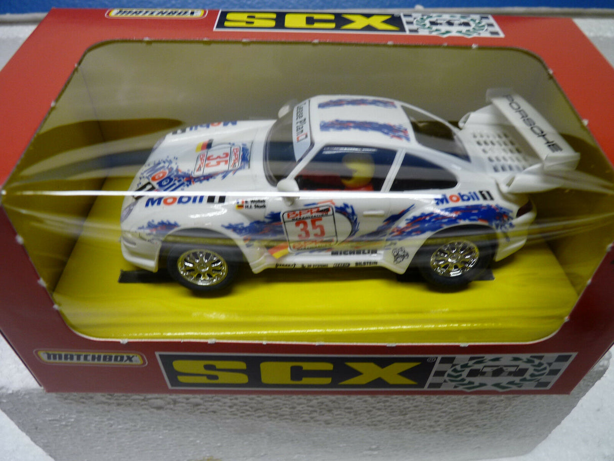 Slot car of a 1996 Porsche 911 race car in its box for SCX 83310.20