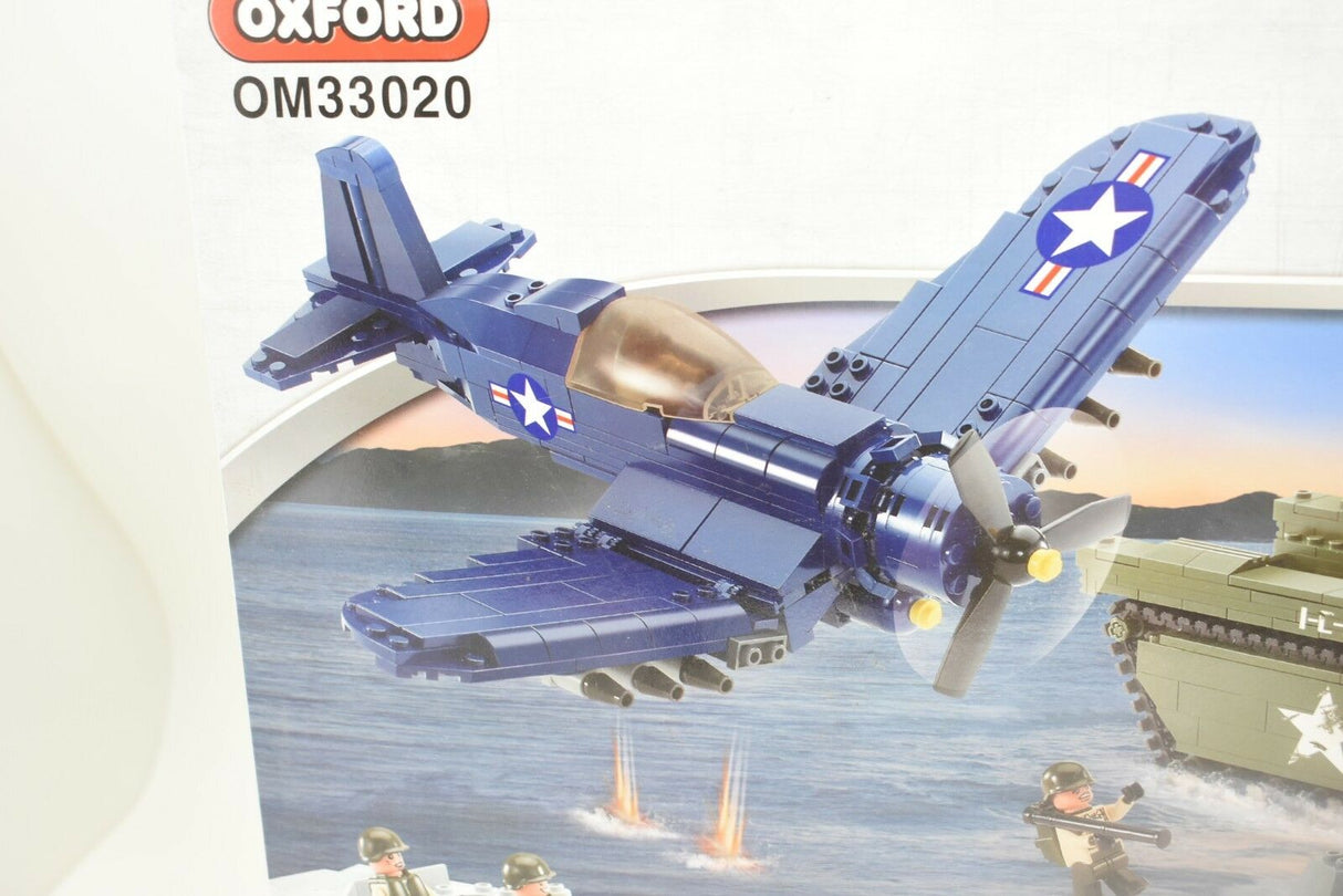 Blue WWII plane flying over water near tanks and soldiers for Oxford OXF33020