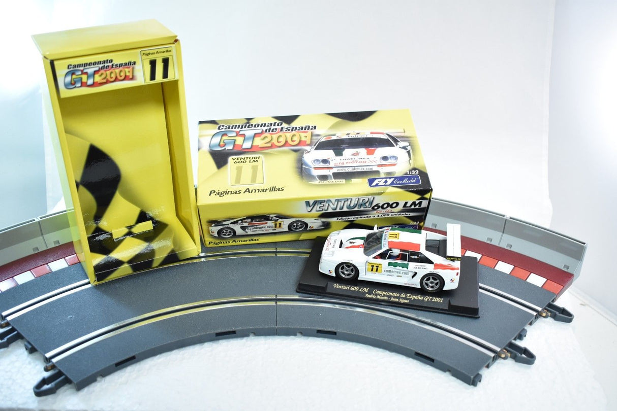 Race track display with Venturi 600LM race car and promotional materials for Fly Car PA2