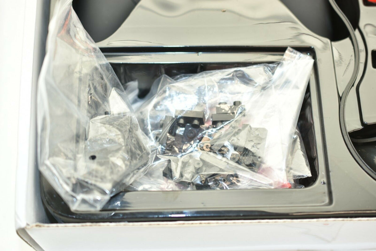 Small electronic components in clear plastic packaging inside a black tray for IMEX 88805