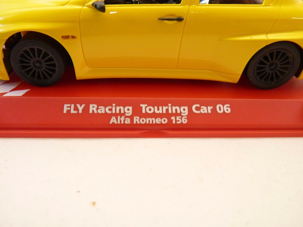 Yellow Alfa Romeo 156 race car model on a red base for REH Fly 07061