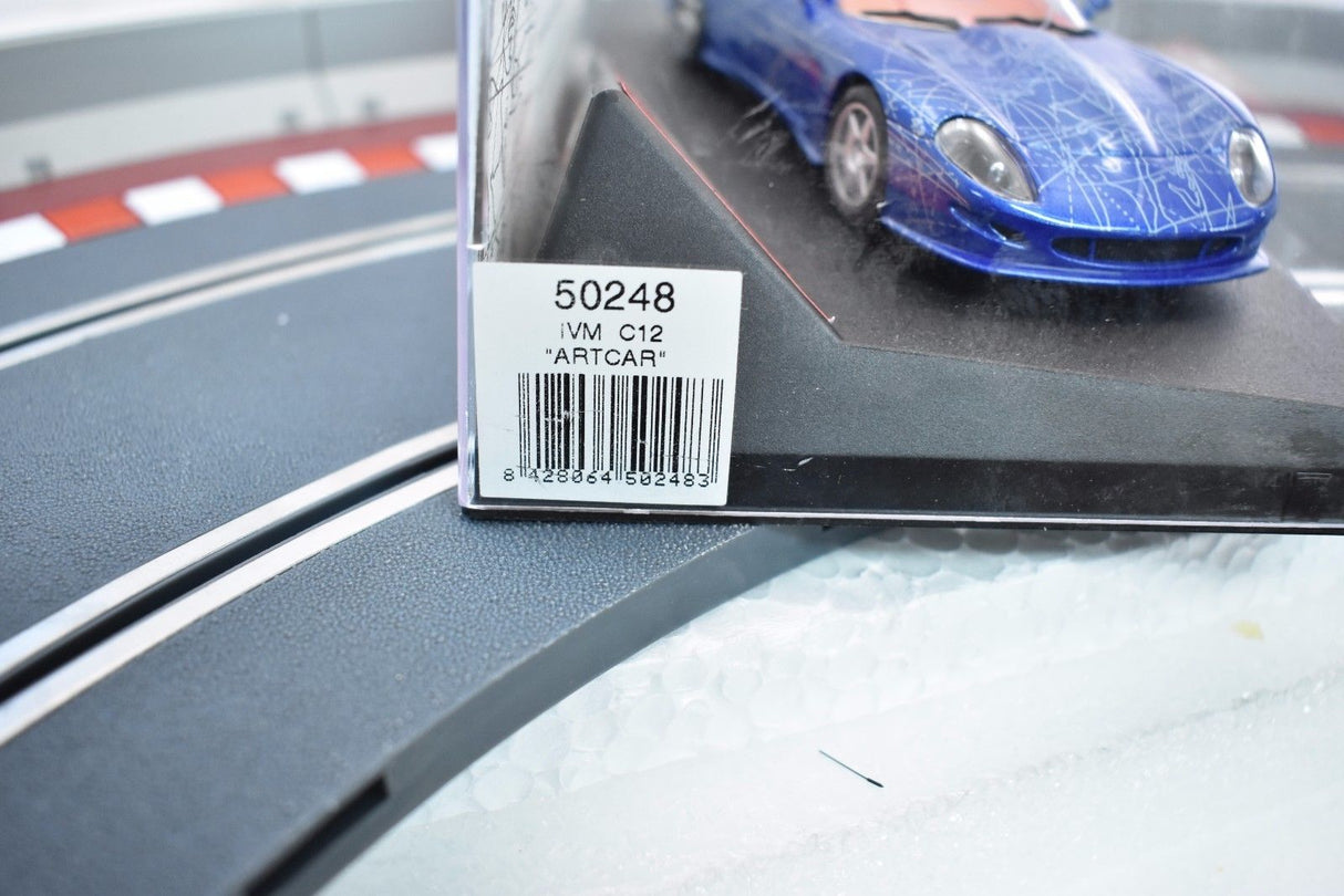 Blue model car on a track section with product box for Ninco 50248
