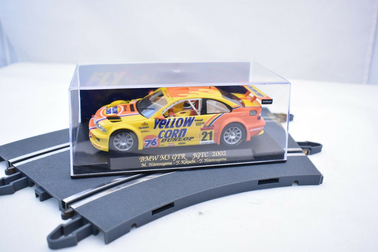 Yellow and orange BMW M3 GTR race car model in clear display case for Fly Car 88017