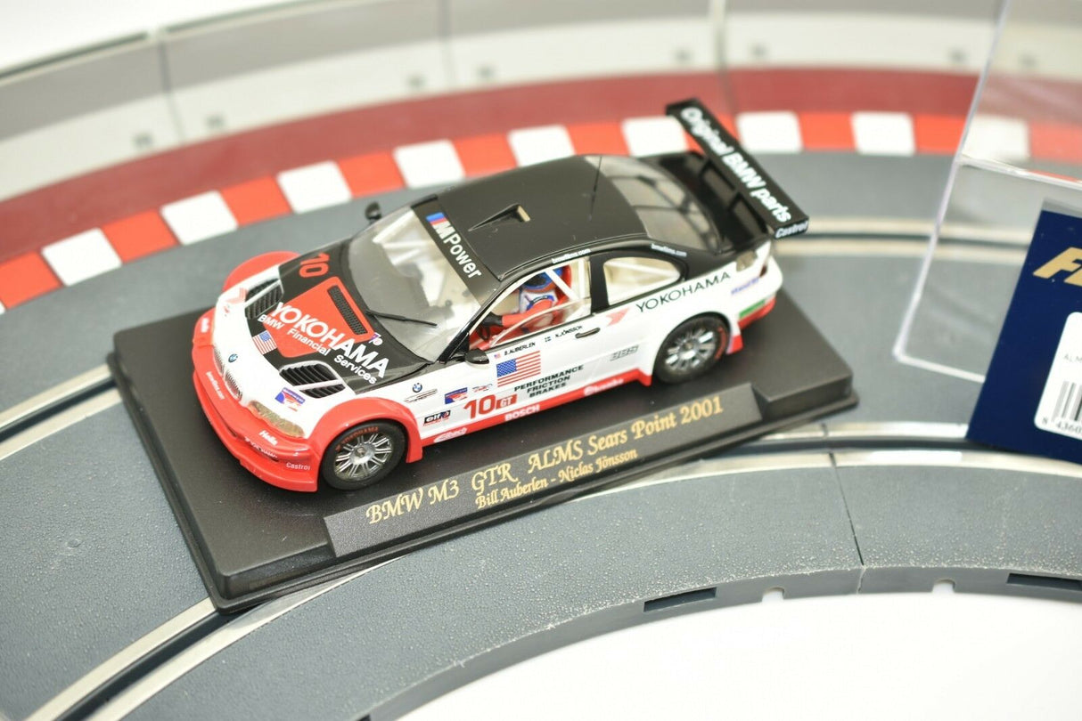 Slot car of a 2001 BMW M3 GTR race car on a track base for Fly Car 99001, track view