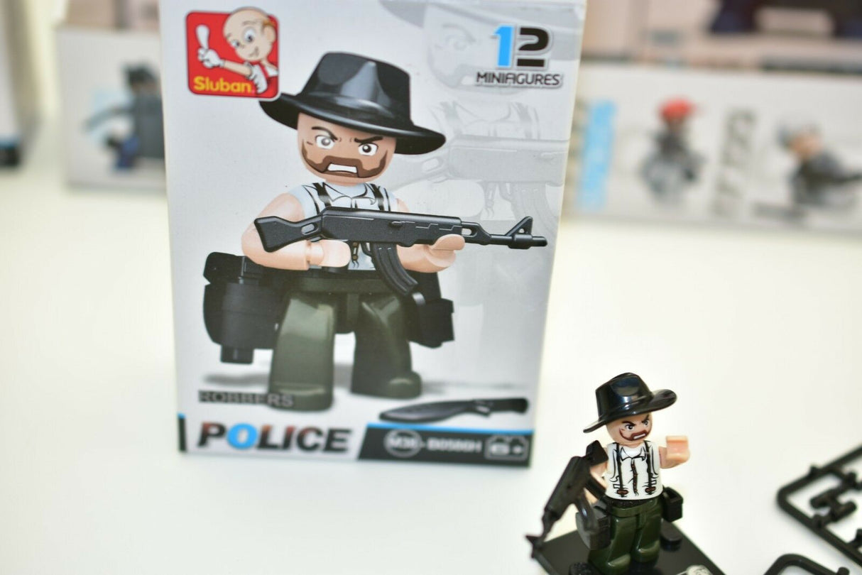 Police minifigure box art and small figure on a surface for Sluban M38-B0586