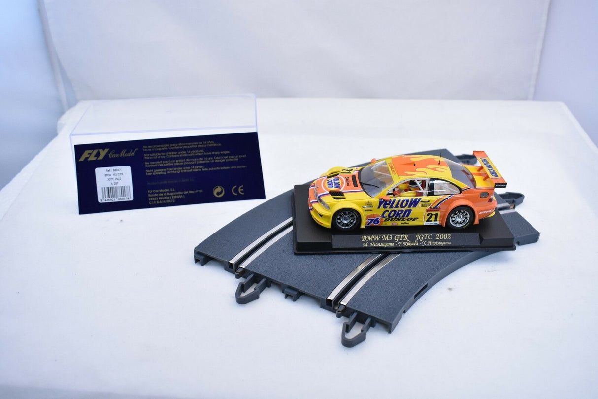 Yellow BMW M3 GTR slot car on display stand for Fly Car 88017