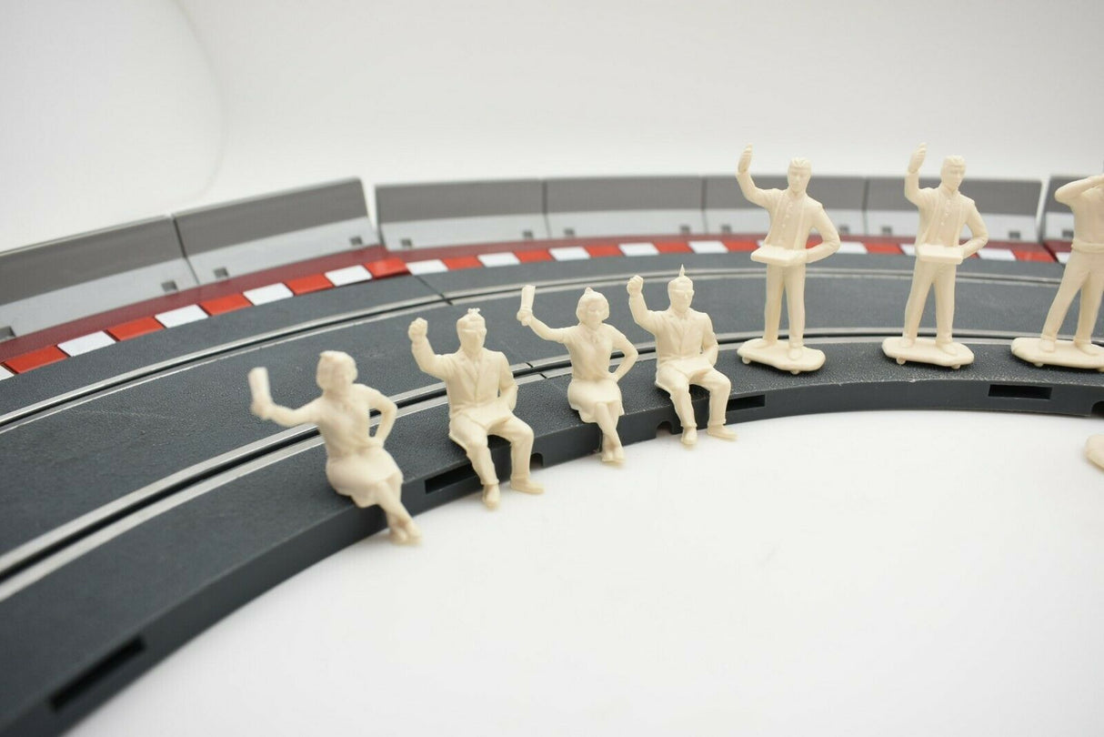 Unpainted 1/32 scale figures of motor racing spectators near a track for HORNBY 303058821440