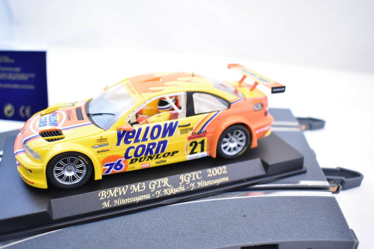 Yellow and orange BMW M3 GTR race car model on a display base for Fly Car 88017