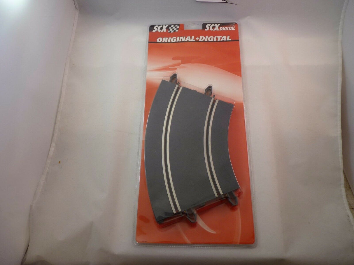 Curved, black and silver automotive trim piece on packaging for SCX B02001X200