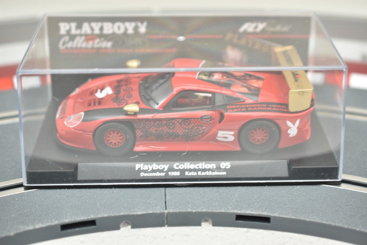 Red sports car model in clear display case, labeled Playboy Collection 05 for Fly Car 99049