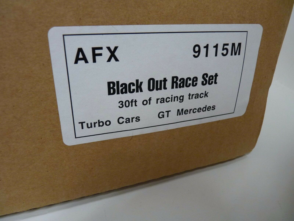 Product label showing "Black Out Race Set" for Turbo Cars, model 9115M for Aurora / AFX / Tomy