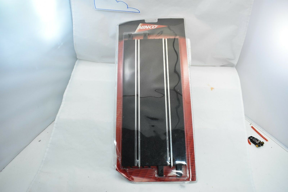 Two black straight tracks for model trains, packaged in clear plastic for Ninco 10102