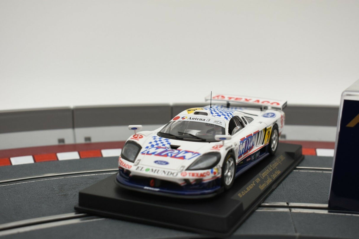 Scale model of a white and blue Saleen S7R race car on a display base for Fly Car 88020