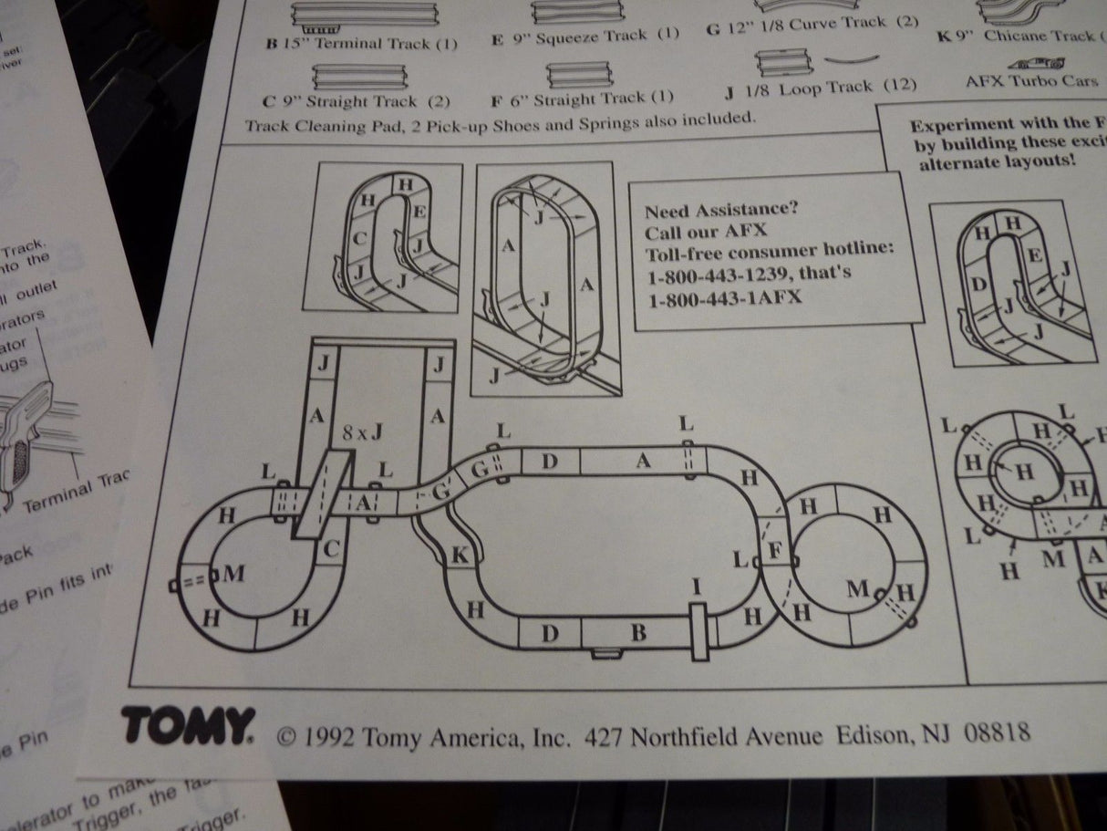 Track layout diagram showing various track pieces for a model train set for Aurora / AFX / Tomy 9115M
