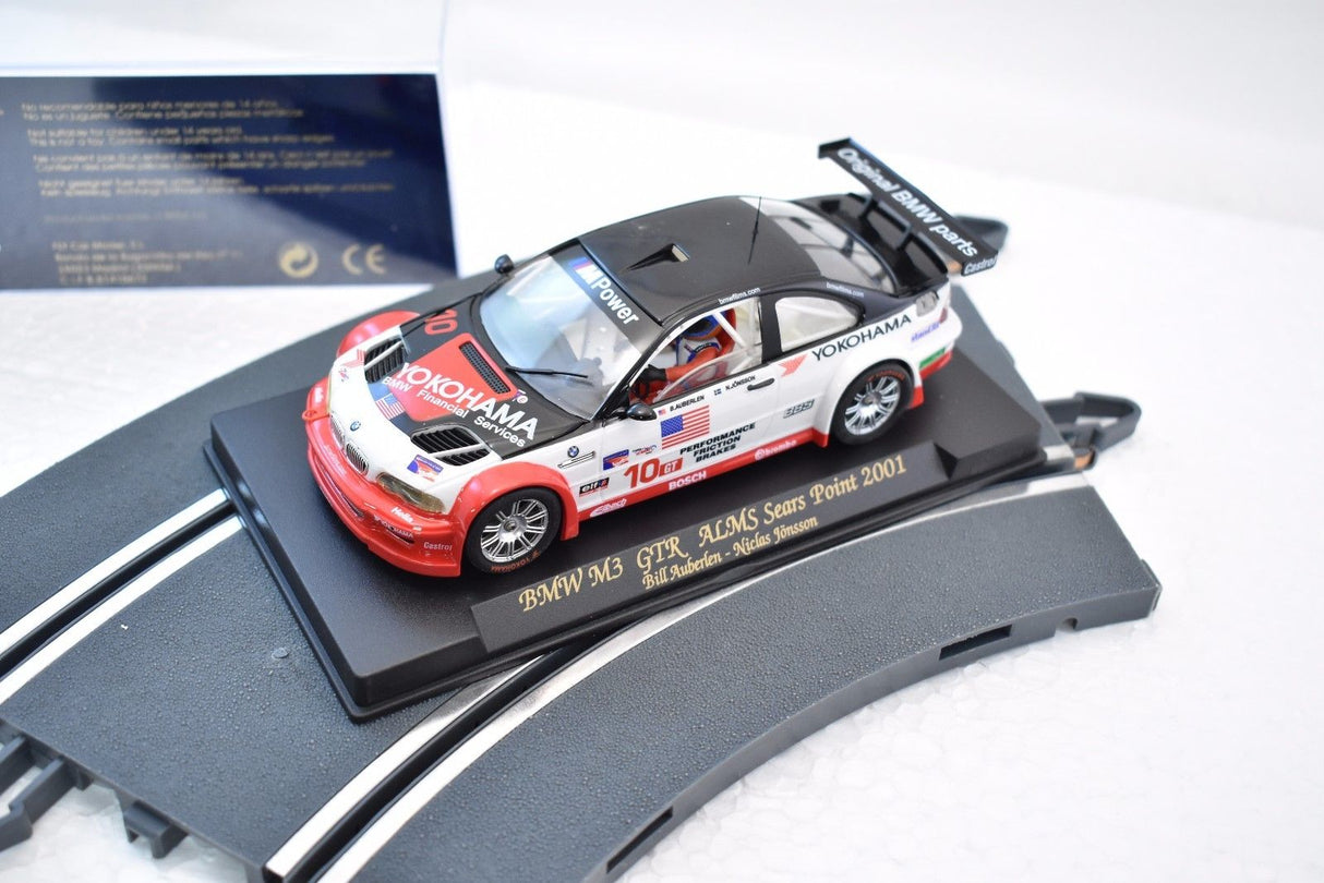Slot car of a 2001 BMW M3 GTR race car on a display base for Fly Car 99001, front view